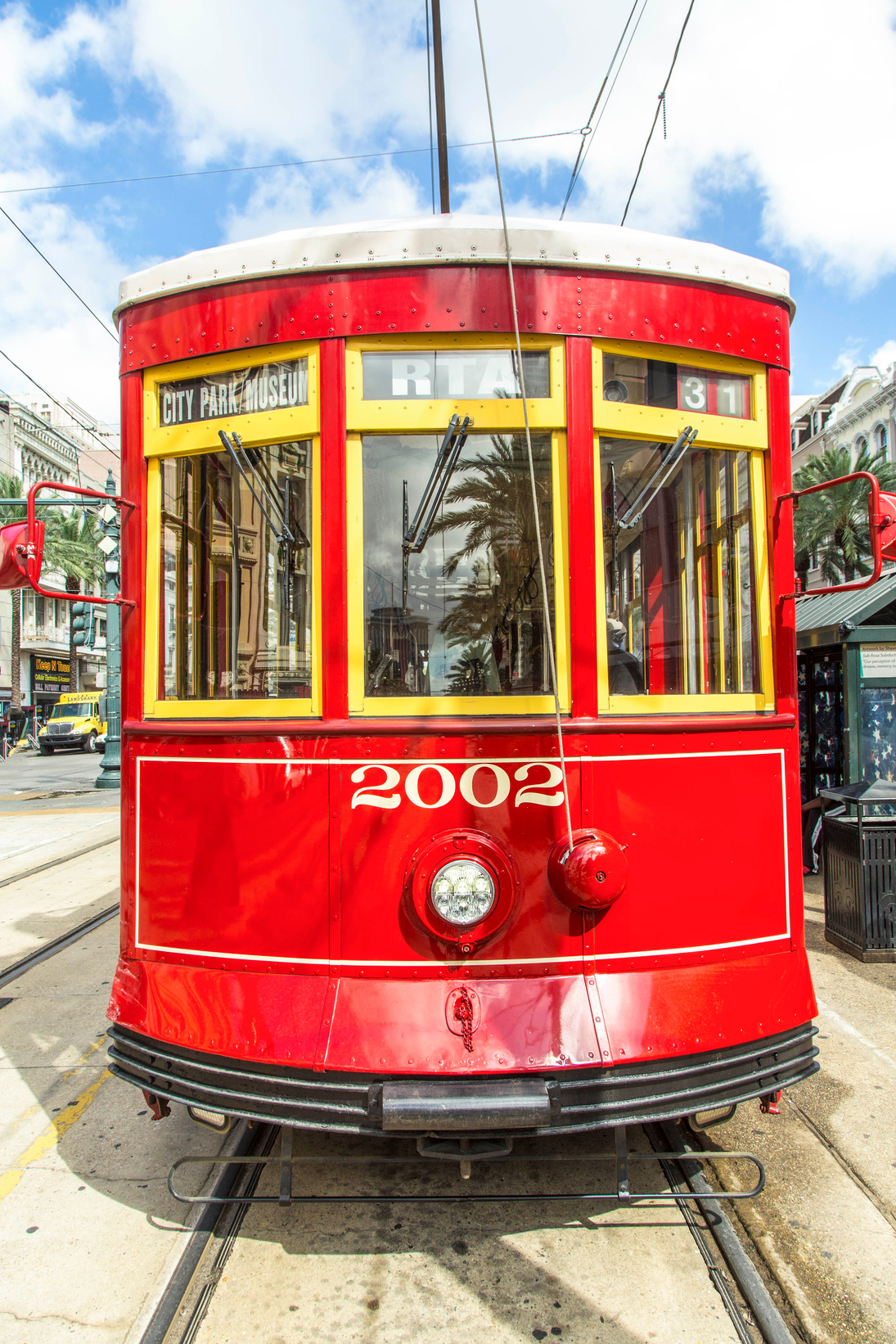 red trolley streetcar on rail in New Orleans French Quarter